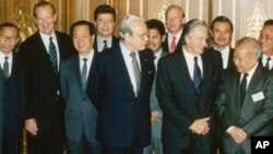 Foreign ministers attending the Paris Peace Conference on Cambodia pose prior to the meeting, Oct. 23, 1991. Front row L-R: United Nations Secretary General Javier Perez de Cuellar, Roland Dumas of France, Cambodia's Prince Norodom Sihanouk, back row L-R: unidentified, U.S. Secretary of State James Baker, Qian Qichen of China, Soviet Union's Boris Pankin, Burnei's Prince Mohamed Bolkiah, Great Britain's Lord Caithness, unidentified, Thailand's Asa Sarasin. (AP Photo)