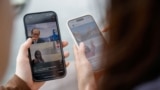 FILE - Users search on the Chinese social media platform Xiaohongshu, in Hong Kong, April 30, 2024.