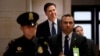 FBI Director James Comey arrives to testify on Capitol Hill in Washington, Dec. 10, 2015. On Thursday, Comey will answer question about why no criminal charges were recommended against Hillary Clinton over her use of a private email server while secretary of state.