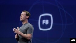 FILE - In this March 25, 2015, file photo, CEO Mark Zuckerberg gestures while delivering the keynote address at the Facebook F8 Developer Conference in San Francisco.