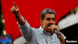 FILE - Venezuelan President Nicolas Maduro delivers a speech in Caracas, Aug. 28, 2024.