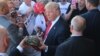 US Republican presidential candidate Donald Trump greets supporters at his campaign rally at Werner Enterprises Hangar in Omaha, Nebraska, May 6, 2016.