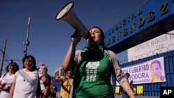 Women protest outside a court, demanding that the government free women prisoners who are serving long prison sentences for suspected abortions, in San Salvador, El Salvador, Dec. 13, 2017.