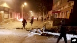 Tunisian Police officers patrol after clashes in the streets of Kasserine, southern of Tunisia, Dec 25, 2018.