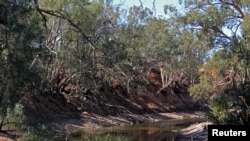 FILE - The drought-affected Darling River sits well below its banks at Pooncarie, a town in outback western New South Wales, Australia, April 25, 2019.
