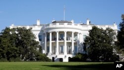 FILE — The White House awash with early morning sun.