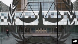 A person leaves the International Criminal Court in The Hague, Netherlands, Wednesday, Jan. 16, 2019, where lawyers were scheduled to discuss the next steps in the case of Gbagbo and ex-youth minister Charles Ble Goude, a day after both men were…