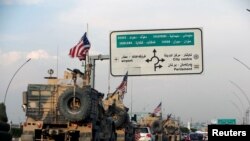 A convoy of U.S. vehicles is seen after withdrawing from northern Syria, in Erbil, Iraq, Oct. 21, 2019. 