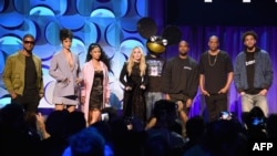 (L-R) Usher, Rihanna, Nicki Minaj, Madonna, Deadmau5, Kanye West, JAY Z, and J. Cole onstage at the Tidal launch event #TIDALforALL at Skylight at Moynihan Station on March 30, 2015 in New York City.
