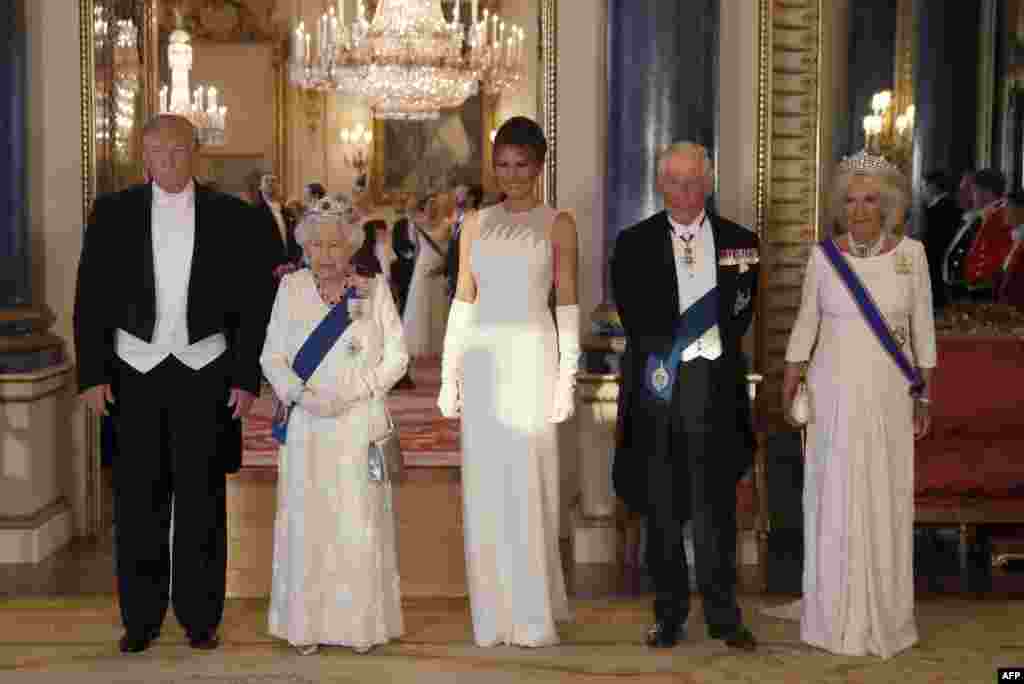 Britain's Queen Elizabeth II (2L), U.S. President Donald Trump (L), First Lady Melania Trump (C), Britain's Prince Charles, Prince of Wales (2R) and Britain's Camilla, Duchess of Cornwall pose for a photograph ahead of a State Banquet in the ballroom at Buckingham Palace in central London, June 3, 2019,