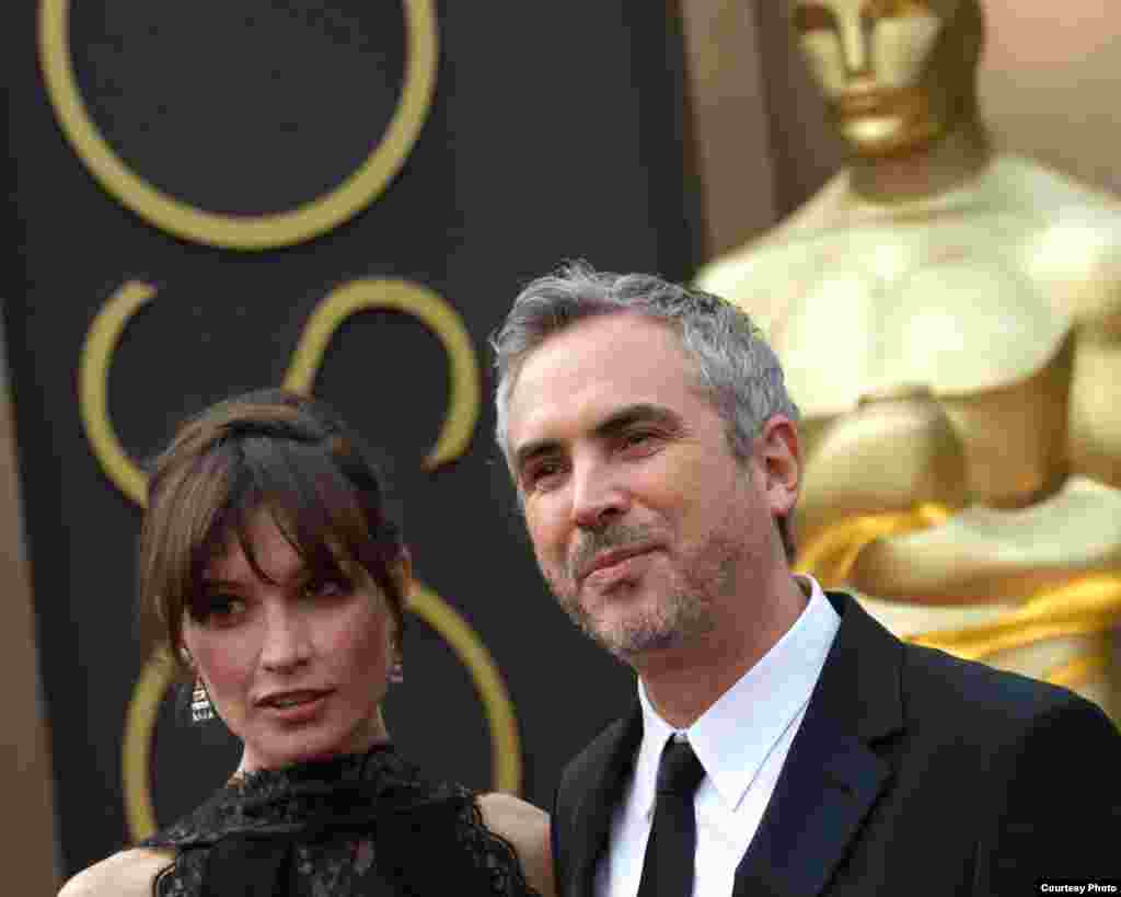 Sheherezade Goldsmith and Oscar®-nominated director, Alfonso Cuaron arrive for The 86th Oscars® on March 2, 2014 in Hollywood, CA (Photo courtesy AMPAS)