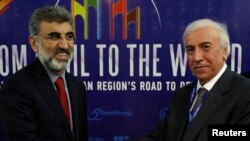 FILE - Kurdistan RaKurdistan Regional Government Natural Resources Minister Ashti Hawrami (R) shakes hands with Turkey's Energy Minister Taner Yildiz during a joint news conference in Arbil, about 350 km (217 miles) north of Baghdad, May 20, 2012.