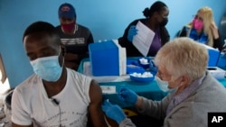 A man gets vaccinated against COVID-19 at a site near Johannesburg, South Africa, Dec. 8, 2021. 