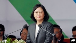 Taiwan's President Tsai Ing-wen delivers a speech during the National Day celebrations in front of the Presidential Building in Taipei, Taiwan, Tuesday, Oct. 10, 2017. (AP Photo/Chiang Ying-ying)