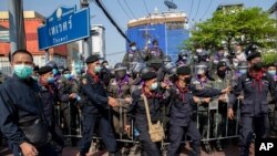 FILE - Police move to strengthen barriers with pro-democracy protesters during a rally, Dec. 10, 2020 in Bangkok, Thailand.