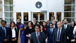 (File) Omar Jadwat, center, director of the ACLU's Immigrants' Rights Project, speaks at a news conference outside a federal courthouse in Greenbelt, Maryland, Oct. 16, 2017, following a hearing regarding three lawsuits against Trump administration.