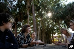 New College of Florida students, from left, Niko Jackson, Viv Cargille, Olivia Pare, Willem Aspinall, and Riley Wood, discuss how changes to the school are affecting their college experience, during a meeting with Associated Press journalists on the New College of Florida campus, Thursday, March 2, 2023, in Sarasota, Fla. (AP Photo/Rebecca Blackwell)