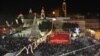 Christian worshippers and tourists celebrate at the Manger Square in front of the Church of the Nativity, in the West Bank town of Bethlehem, December 24, 2012. 