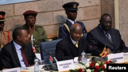 From left, Kenyan President Uhuru Kenyatta, Ugandan President Yoweri Museveni and Central African Republic President Michel Djotodia attend Heads of States and Governments International Conference on the Great Lakes Region, Nairobi, July 31, 2013.