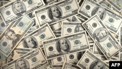 FILE - US currency is seen in this January 30, 2001 image.