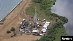 FILE - Handout image from Tullow Oil Uganda shows aerial view of oil exploration site in Bulisa district, approximately 152 miles northwest of Kampala, July 2012.