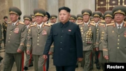 North Korean leader Kim Jong Un and military officers visit Kumsusan Palace on the anniversary of the armistice signing that ended the Korean War. Photo released by Korean Central News Agency in Pyongyang July 27, 2014.