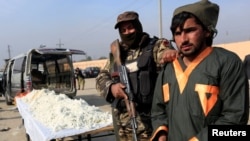 A captured Taliban insurgent is presented to the media after he was detained with car explosive devices in Jalalabad, Afghanistan Dec. 10, 2019.