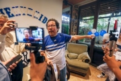 FILE - Nicaraguan journalist Miguel Mora speaks to the press after his release from prison, at his home in Managua, June 11, 2019. The presidential candidate was arrested again on June 20, 2021.