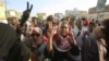 Sudanese protesters chant slogans during a rally calling for the former ruling party to be dissolved and for ex-officials to be put on trial in Khartoum, Sudan, Oct. 21, 2019. 