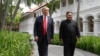FILE - U.S. President Donald Trump and North Korea leader Kim Jong Un walk from their lunch at the Capella resort on Sentosa Island in Singapore, June 12, 2018. 