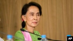 FILE - Myanmar's opposition leader Aung San Suu Kyi is seen in Naypyitaw, Myanmar, Nov. 13, 2014.