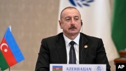 FILE - In this photo released by Uzbekistan's President Press Office, Azerbaijan's President Ilham Aliyev attends the Summit of the Economic Cooperation Organisation in Tashkent, Uzbekistan, on Nov. 9, 2023. 