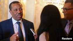 Libya's Prime Minister Abdullah al-Thinni speaks to reporters in Abu Dhabi, Sept. 10, 2014.