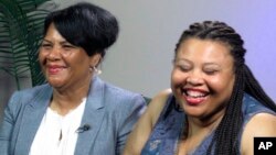 Alice Marie Johnson, left, and her daughter Katina Marie Scales wait to start a TV interview, June 7, 2018 in Memphis, Tennessee.