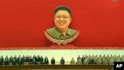 orth Korean leader Kim Jong Un, center, attends an event to mark the second anniversary of the death of his father, former leader Kim Jong Il, in Pyongyang, North Korea Tuesday, Dec. 17, 2013.