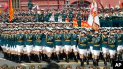Russian soldiers march toward Red Square during the Victory Day military parade marking the 75th anniversary of the Nazi defeat in Moscow, Russia, June 24, 2020.