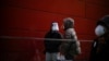 'Please Protect Yourself': China Wrestles With COVID Surge