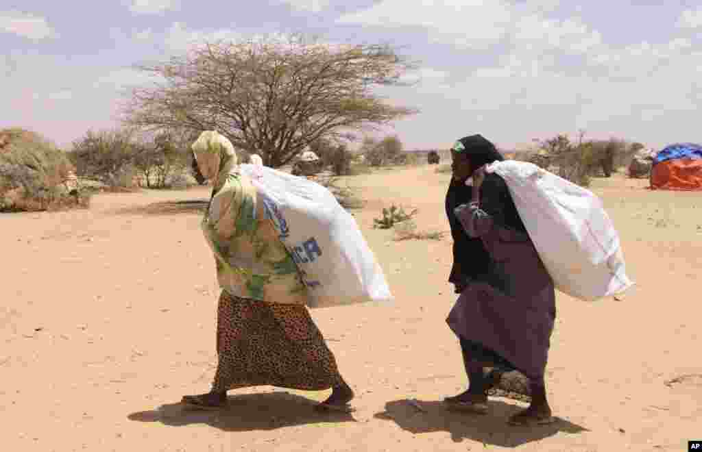 SOMALIA: Drought and famine force populations to seek refuge in UNHCR camps such as Dollow, where they can receive food aid. AP Photograph taken during the Muslim holiday of Eid al-Fitr, Aug. 30, 2011. 