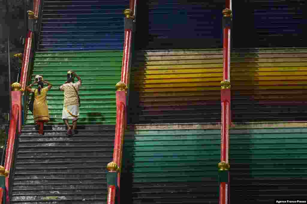 Hindu devotees carry "Paal Kudam" (milk pots) ahead of the Thaipusam festival in Kuala Lumpur, Malaysia.