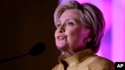 Former Secretary of State Hillary Clinton speaks during a fundraising event for Big Sister Association of Greater Boston, Dec. 5, 2017, in Boston. Clinton was presented with the organization's Believe in Girls award during the event.