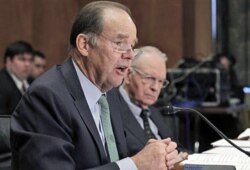 FILE - Thomas Kean, left, and Lee Hamilton, former co-chairmen of the 9/11 Commission, testify before a U.S. Senate committee on the report on circumstances surrounding the Sept. 11, 2001, terrorist attack.