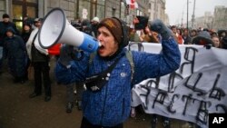 Belarusians shout slogans during a rally in support of sole traders in the city center in Minsk, Belarus, Feb. 28, 2016.