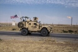 In this Oct. 28, 2019 photo, U.S. forces patrol Syrian oil fields.