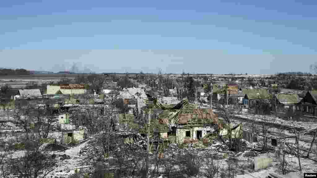 Fighting damaged buildings in the village of Nikishine, southeast of Debaltseve, Ukraine, Feb. 17, 2015.