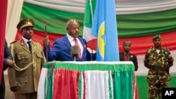 Burundi's President Pierre Nkurunziza is sworn in for a third term at a ceremony in the parliament in Bujumbura, Burundi, Thursday, Aug. 20, 2015. 