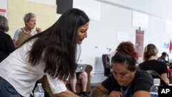 Deb Haaland, center, a member of the Laguna Pueblo, speaks with campaign organizers ahead of Democratic Primary elections at the Haaland headquarters in Albuquerque, New Mexico Tuesday afternoon June 5, 2018.