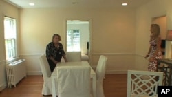 Gloria Crowley (left) works with interior designer Jania Helm to stage a vacant home in a way that will appeal to the broadest audience.