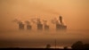 FILE - Steam rises at sunrise from the Lethabo Power Station, a coal-fired power station owned by state power utility ESKOM near Sasolburg, South Africa, March 2, 2016. 