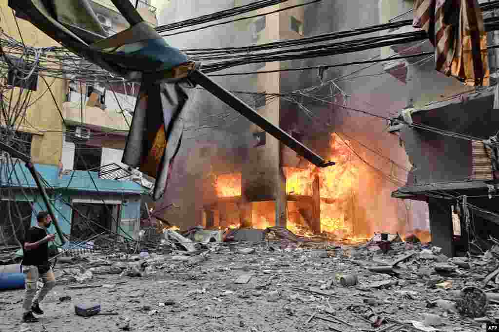 A fire rages inside a building hit by an Israeli airstrike that targeted the neighborhood of Haret Hreik in Beirut's southern suburbs, Lebanon.