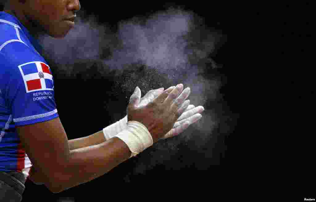 Dominican's Republic Beatriz Piron prepares to lift in the women 48Kg Group A weightlifting competition at the London 2012 Olympic Games July 28, 2012.